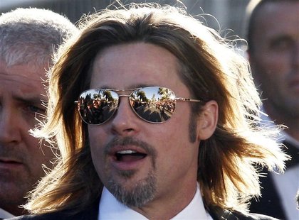 Cast member Brad Pitt poses on the red carpet ahead of the screening of the film "Killing Them Softly", in competition at the 65th Cannes Fi Cast member Brad Pitt poses on the red carpet ahead of the screening of the film "Killing Them Softly", in competition at the 65th Cannes Fi