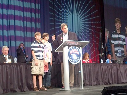 Garrett Huizenga is standing to the immediate right of US House Rep. Bill Huizenga (R-Zeeland) during an appearance at the May 19, 2012 Michigan Republican Party Convention in Detroit (photo courtesy Huizenga for Congress campaign) Garrett Huizenga is standing to the immediate right of US House Rep. Bill Huizenga (R-Zeeland) during an appearance at the May 19, 2012 Michigan Republican Party Convention in Detroit (photo courtesy Huizenga for Congress campaign)
