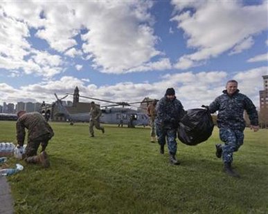 Sailors and Marines arrive in Hoboken, New Jersey with water and supplies from a U.S. Navy Seahawk helicopter for superstorm Sandy relief efforts in this November 3, 2012 handout photo. REUTERS/U.S. Marine Corps/Cpl. Bryan Nygaard Sailors and Marines arrive in Hoboken, New Jersey with water and supplies from a U.S. Navy Seahawk helicopter for superstorm Sandy relief efforts in this November 3, 2012 handout photo. REUTERS/U.S. Marine Corps/Cpl. Bryan Nygaard
