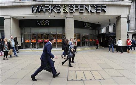 Pedestrians walk past the Marble Arch branch of Marks and Spencer in central London June 8, 2011. REUTERS/Paul Hackett Pedestrians walk past the Marble Arch branch of Marks and Spencer in central London June 8, 2011. REUTERS/Paul Hackett