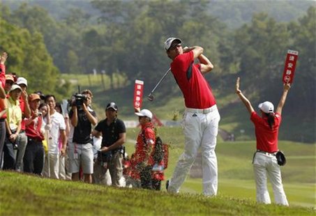 Adam Scott of Australia hits a shot on the rough off the ninth fairway during the third day of the WGC-HSBC Champions Tournament at Mission Adam Scott of Australia hits a shot on the rough off the ninth fairway during the third day of the WGC-HSBC Champions Tournament at Mission