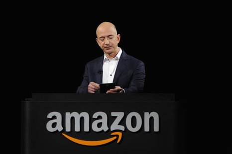 Amazon CEO Jeff Bezos demonstrates the Kindle Paperwhite during Amazon's Kindle Fire event in Santa Monica, California September 6, 2012. RE Amazon CEO Jeff Bezos demonstrates the Kindle Paperwhite during Amazon's Kindle Fire event in Santa Monica, California September 6, 2012. RE