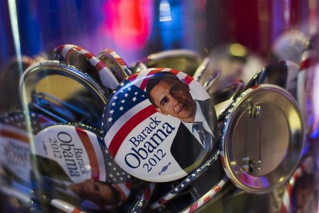 Buttons with portraits of U.S. President Barack Obama lie in a glass bowl during the U.S. election night at the representation of the Bertel Buttons with portraits of U.S. President Barack Obama lie in a glass bowl during the U.S. election night at the representation of the Bertel