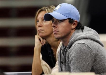Golfer Rory McIlroy watches from the stands the WTA Tournament of Champions final match between Caroline Wozniacki of Denmark and Nadia Petr Golfer Rory McIlroy watches from the stands the WTA Tournament of Champions final match between Caroline Wozniacki of Denmark and Nadia Petr