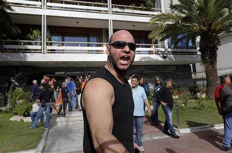 A municipality worker shouts anti-government slogans as dozens of striking workers have occupied the Ministry of Interior in Athens November A municipality worker shouts anti-government slogans as dozens of striking workers have occupied the Ministry of Interior in Athens November