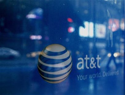 Reflections are seen in the window of an AT&T store in New York March 21, 2011. REUTERS/Brendan McDermid Reflections are seen in the window of an AT&T store in New York March 21, 2011. REUTERS/Brendan McDermid