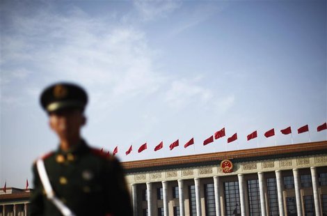 A police officer stands guard in front of the Great Hall of the People at Beijing's Tiananmen Square, November 7, 2012. REUTERS/Carlos Barri A police officer stands guard in front of the Great Hall of the People at Beijing's Tiananmen Square, November 7, 2012. REUTERS/Carlos Barri
