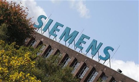 The logo of Siemens AG company is pictured atop a factory in Berlin October 9, 2012. REUTERS/Fabrizio Bensch The logo of Siemens AG company is pictured atop a factory in Berlin October 9, 2012. REUTERS/Fabrizio Bensch