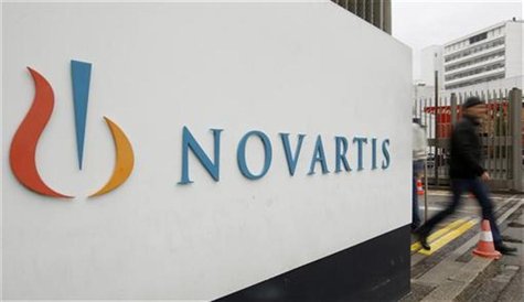 A man walks past the logo of Swiss drugmaker Novartis AG in front of a plant in Basel October 25, 2011. REUTERS/Arnd Wiegmann A man walks past the logo of Swiss drugmaker Novartis AG in front of a plant in Basel October 25, 2011. REUTERS/Arnd Wiegmann