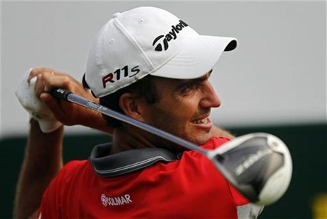 Edoardo Molinari of Italy watches his shot on the first hole during the BMW Masters 2012 golf tournament at Lake Malaren Golf Club in Shangh Edoardo Molinari of Italy watches his shot on the first hole during the BMW Masters 2012 golf tournament at Lake Malaren Golf Club in Shangh