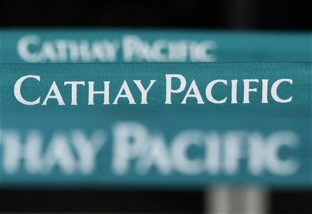 Lined up banners are seen at a city check-in counter of Cathay Pacific Airways in downtown Hong Kong August 8, 2012. REUTERS/Bobby Yip Lined up banners are seen at a city check-in counter of Cathay Pacific Airways in downtown Hong Kong August 8, 2012. REUTERS/Bobby Yip