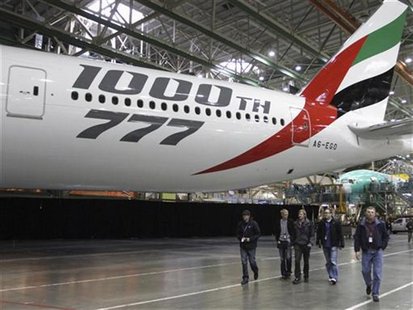An Emirates Airline Boeing 777-300ER airplane is seen during the delivery ceremony by Boeing for the 1000th Boeing 777 to Emirates Airline & An Emirates Airline Boeing 777-300ER airplane is seen during the delivery ceremony by Boeing for the 1000th Boeing 777 to Emirates Airline &