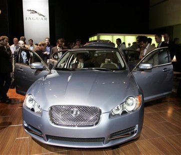 People inspect the Jaguar XF vehicle during the Los Angeles Auto Show in Los Angeles, California November 14, 2007. REUTERS/Danny Moloshok People inspect the Jaguar XF vehicle during the Los Angeles Auto Show in Los Angeles, California November 14, 2007. REUTERS/Danny Moloshok