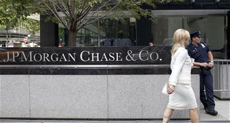 A woman walks past JPMorgan Chase & Co's international headquarters on Park Avenue in New York July 13, 2012. REUTERS/Andrew Burton A woman walks past JPMorgan Chase & Co's international headquarters on Park Avenue in New York July 13, 2012. REUTERS/Andrew Burton