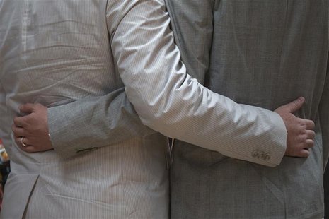 Scott Everhart and Jason Welker hold each other before exchanging wedding vows at a comic book retail shop in Manhattan, New York June 20, 2 Scott Everhart and Jason Welker hold each other before exchanging wedding vows at a comic book retail shop in Manhattan, New York June 20, 2