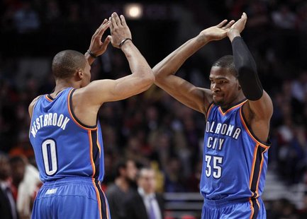 Oklahoma City Thunder point guard Russell Westbrook (0) and Kevin Durant (35) celebrates after a made basket against the Chicago Bulls durin Oklahoma City Thunder point guard Russell Westbrook (0) and Kevin Durant (35) celebrates after a made basket against the Chicago Bulls durin