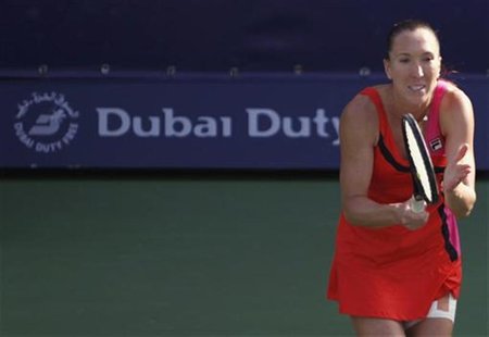 Jelena Jankovic of Serbia reacts after hitting a return to Sam Stosur of Australia during their women's singles quarter-final match at the W Jelena Jankovic of Serbia reacts after hitting a return to Sam Stosur of Australia during their women's singles quarter-final match at the W