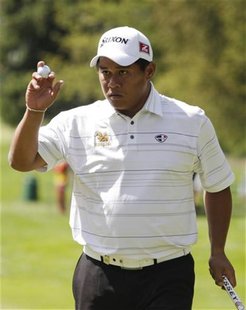 Chapchai Nirat of Thailand celebrates his birdie shot on the 9th green during the first round of the European Masters golf tournament in Cra Chapchai Nirat of Thailand celebrates his birdie shot on the 9th green during the first round of the European Masters golf tournament in Cra