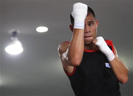 Chris "The Dragon" John of Indonesia shadow boxes during an open training session ahead of his fight at a gym in Singapore November 6, 2012. Chris "The Dragon" John of Indonesia shadow boxes during an open training session ahead of his fight at a gym in Singapore November 6, 2012.