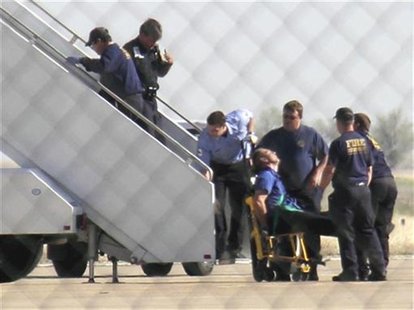 JetBlue pilot captain Clayton Osbon, is removed from the plane after erratic behavior forced the crew to land in Amarillo, Texas, in this fi JetBlue pilot captain Clayton Osbon, is removed from the plane after erratic behavior forced the crew to land in Amarillo, Texas, in this fi