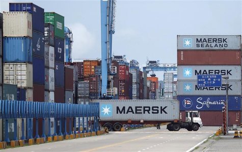 A truck ferries a container at Ningbo port in Ningbo, Zhejiang province June 21, 2012. REUTERS/Carlos Barria A truck ferries a container at Ningbo port in Ningbo, Zhejiang province June 21, 2012. REUTERS/Carlos Barria