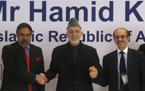 Afghanistan's President Hamid Karzai (C) shakes hands with India's Trade Minister Anand Sharma (L) and Chairman of the Godrej Group Adi Godr Afghanistan's President Hamid Karzai (C) shakes hands with India's Trade Minister Anand Sharma (L) and Chairman of the Godrej Group Adi Godr