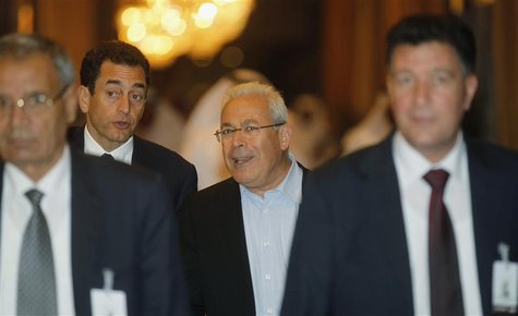 Former Syrian National Council (SNC) chief Burhan Ghalioun (C) arrives at the meeting of the General Assembly of the Syrian National Council Former Syrian National Council (SNC) chief Burhan Ghalioun (C) arrives at the meeting of the General Assembly of the Syrian National Council
