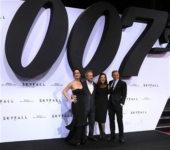 Actress Berenice Marlohe, director Sam Mendes, producer Barbara Broccoli and actor Daniel Craig (L-R) pose on the red carpet as they arrive Actress Berenice Marlohe, director Sam Mendes, producer Barbara Broccoli and actor Daniel Craig (L-R) pose on the red carpet as they arrive