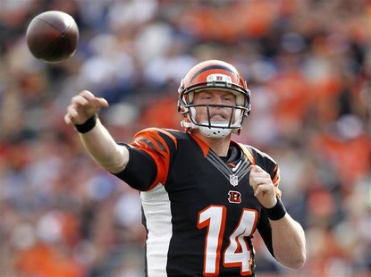 Cincinnati Bengals quarterback Andy Dalton (14) throws under pressure from New York Giants during the first half of play in their NFL footba Cincinnati Bengals quarterback Andy Dalton (14) throws under pressure from New York Giants during the first half of play in their NFL footba