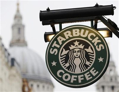 St Paul's Cathedral is pictured behind signage for a Starbucks coffee shop in London October 8, 2012. Picture taken October 8, 2012. REUTERS St Paul's Cathedral is pictured behind signage for a Starbucks coffee shop in London October 8, 2012. Picture taken October 8, 2012. REUTERS