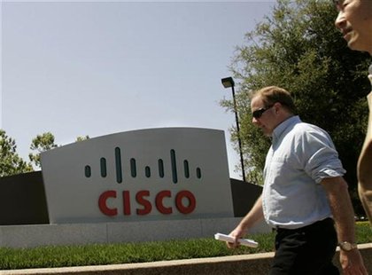 Pedestrians walks past the headquarters of Cisco Systems Inc. in San Jose, California May 6, 2008. REUTERS/Robert Galbraith Pedestrians walks past the headquarters of Cisco Systems Inc. in San Jose, California May 6, 2008. REUTERS/Robert Galbraith