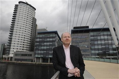 Mark Thompson poses for media on a visit to Media City the company's new northern headquarters in Salford, northern England in this May 10, Mark Thompson poses for media on a visit to Media City the company's new northern headquarters in Salford, northern England in this May 10,