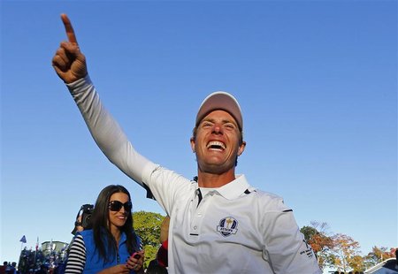 Team Europe golfer Nicolas Colsaerts of Belgium celebrates winning the Ryder Cup for Europe during the 39th Ryder Cup singles golf matches a Team Europe golfer Nicolas Colsaerts of Belgium celebrates winning the Ryder Cup for Europe during the 39th Ryder Cup singles golf matches a