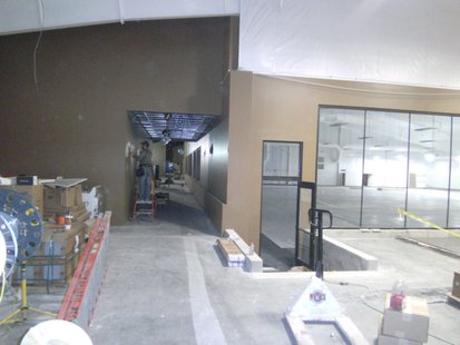 Wausau Curling Club, just inside the main entrance. An electrician is working in the hallway to the concession area. The windows on the right look out over the ice rink. Wausau Curling Club, just inside the main entrance. An electrician is working in the hallway to the concession area. The windows on the right look out over the ice rink.