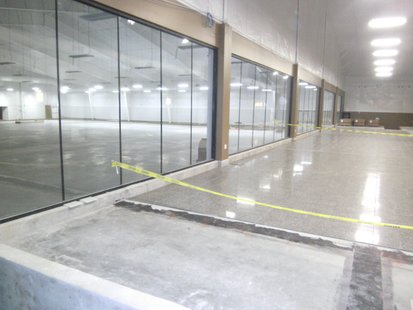 Wausau Curling Club's main entrance area, where floor tile has been installed. The ice rink is through the windows on the left. Wausau Curling Club's main entrance area, where floor tile has been installed. The ice rink is through the windows on the left.