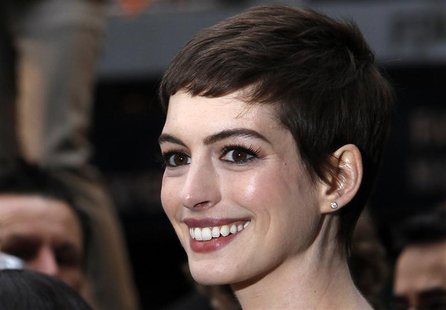 Actress Anne Hathaway poses for photographers as she arrives at the European Premiere of "The Dark Knight Rises" in Leicester Square, centra Actress Anne Hathaway poses for photographers as she arrives at the European Premiere of "The Dark Knight Rises" in Leicester Square, centra