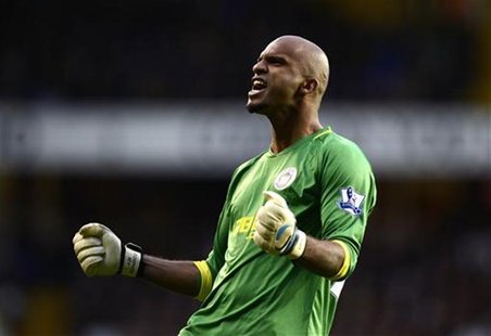 Wigan Athletic's goalkeeper Ali Al Habsi celebrates after team mate Ben Watson scored against Tottenham Hotspur during their English Premier Wigan Athletic's goalkeeper Ali Al Habsi celebrates after team mate Ben Watson scored against Tottenham Hotspur during their English Premier