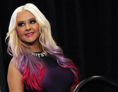 Christina Aguilera poses after a news conference to announce the 40th Anniversary American Music Awards nominations in Los Angeles, Californ Christina Aguilera poses after a news conference to announce the 40th Anniversary American Music Awards nominations in Los Angeles, Californ