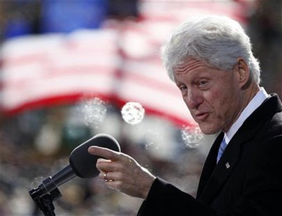 Former U.S. President Bill Clinton speaks to a crowd at a campaign event for U.S. President Barack Obama at State Capitol Square in Concord, Former U.S. President Bill Clinton speaks to a crowd at a campaign event for U.S. President Barack Obama at State Capitol Square in Concord,