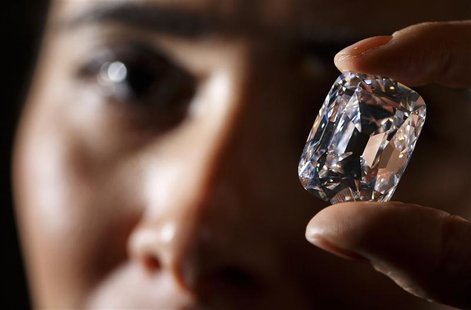 An employee poses with the Archduke Joseph diamond during an auction preview at Christie's in Geneva in this file photo taken November 8, 20 An employee poses with the Archduke Joseph diamond during an auction preview at Christie's in Geneva in this file photo taken November 8, 20