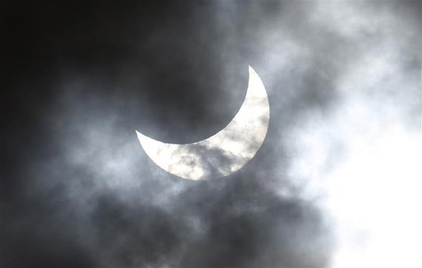 Clouds obscure the moon passing in front of the sun as it approaches a full solar eclipse in the northern Australian city of Cairns November Clouds obscure the moon passing in front of the sun as it approaches a full solar eclipse in the northern Australian city of Cairns November