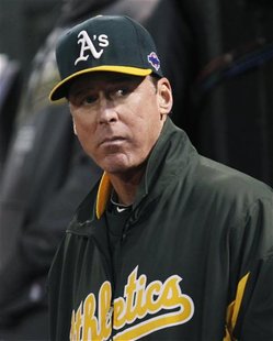 Oakland Athletics manager Bob Melvin watches from the dugout as his team plays the Detroit Tigers in Game 4 of their MLB ALDS playoff baseba Oakland Athletics manager Bob Melvin watches from the dugout as his team plays the Detroit Tigers in Game 4 of their MLB ALDS playoff baseba