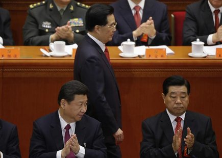 China's Vice President Xi Jinping and top political advisor Jia Qinglin applaud as China's President Hu Jintao walks past after delivering s China's Vice President Xi Jinping and top political advisor Jia Qinglin applaud as China's President Hu Jintao walks past after delivering s