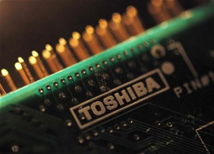 A logo of Toshiba Corp is seen on a printed circuit board in this photo illustration taken in Tokyo July 31, 2012. REUTERS/Yuriko Nakao A logo of Toshiba Corp is seen on a printed circuit board in this photo illustration taken in Tokyo July 31, 2012. REUTERS/Yuriko Nakao