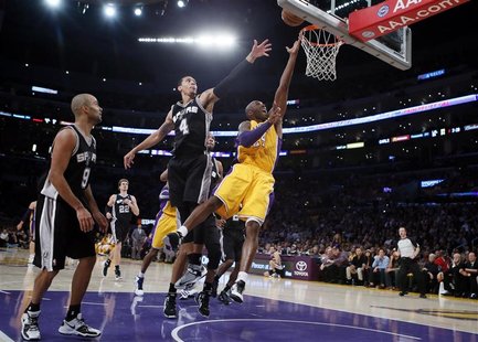 Los Angeles Lakers Kobe Bryant (R) goes up to shoot against the San Antonio Spurs during their NBA basketball game in Los Angeles, November Los Angeles Lakers Kobe Bryant (R) goes up to shoot against the San Antonio Spurs during their NBA basketball game in Los Angeles, November