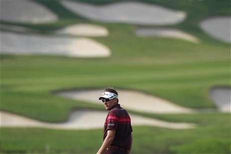 Ian Poulter of England looks back on the 15th fairway during the final day of the WGC-HSBC Champions Tournament at Mission Hills in the sout Ian Poulter of England looks back on the 15th fairway during the final day of the WGC-HSBC Champions Tournament at Mission Hills in the sout
