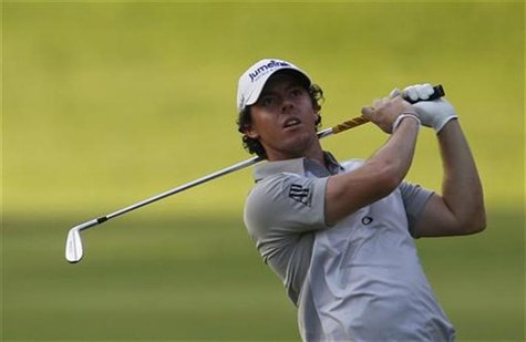 Rory McIlroy of Northern Ireland watches his shot on the 10th hole from during the third round of the Barclays Singapore Open golf tournamen Rory McIlroy of Northern Ireland watches his shot on the 10th hole from during the third round of the Barclays Singapore Open golf tournamen