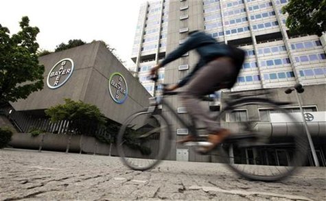 A man rides a bicycle in front of the building of Germany's largest drugmaker Bayer HealthCare Pharmaceuticals in Berlin April 28, 2011. REU A man rides a bicycle in front of the building of Germany's largest drugmaker Bayer HealthCare Pharmaceuticals in Berlin April 28, 2011. REU