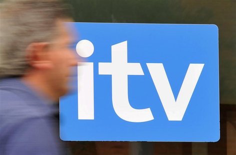 A man passes ITV television studios in central London August 3, 2010. REUTERS/Toby Melville A man passes ITV television studios in central London August 3, 2010. REUTERS/Toby Melville