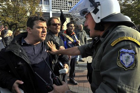 A protester argues with a policeman during an anti-austerity rally in Thessaloniki, northern Greece November 15, 2012. REUTERS/Alexandros Av A protester argues with a policeman during an anti-austerity rally in Thessaloniki, northern Greece November 15, 2012. REUTERS/Alexandros Av